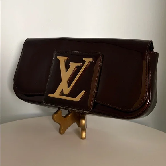Louis Vuitton Burgundy Sobe clutch with Brass Hardware